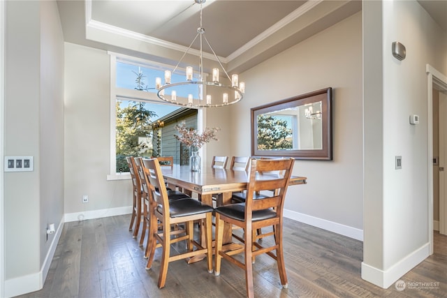 dining room with plenty of natural light, dark hardwood / wood-style flooring, and crown molding