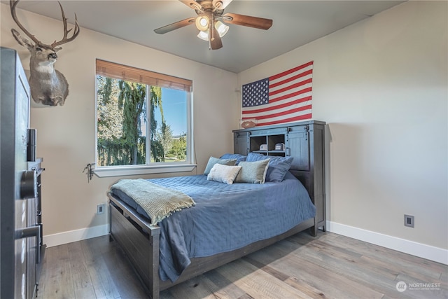 bedroom featuring hardwood / wood-style floors and ceiling fan