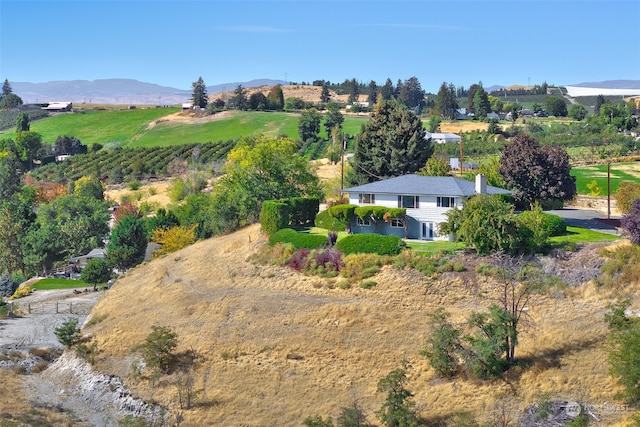 drone / aerial view featuring a rural view and a mountain view