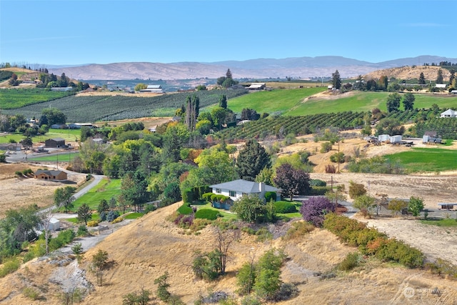 birds eye view of property featuring a mountain view and a rural view