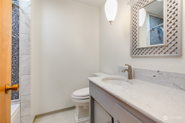 bathroom featuring vanity, toilet, and tile patterned floors