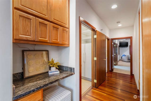 hallway featuring dark hardwood / wood-style flooring