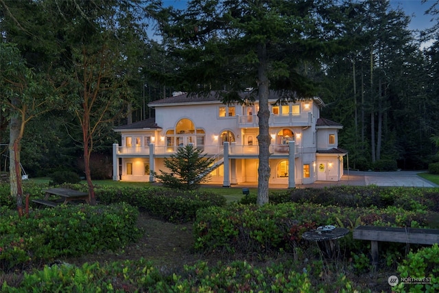 back of house with a balcony