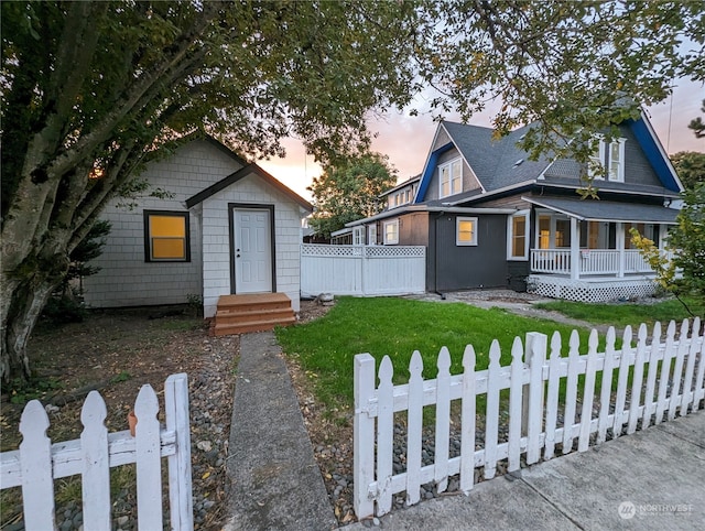 view of front of property with a yard