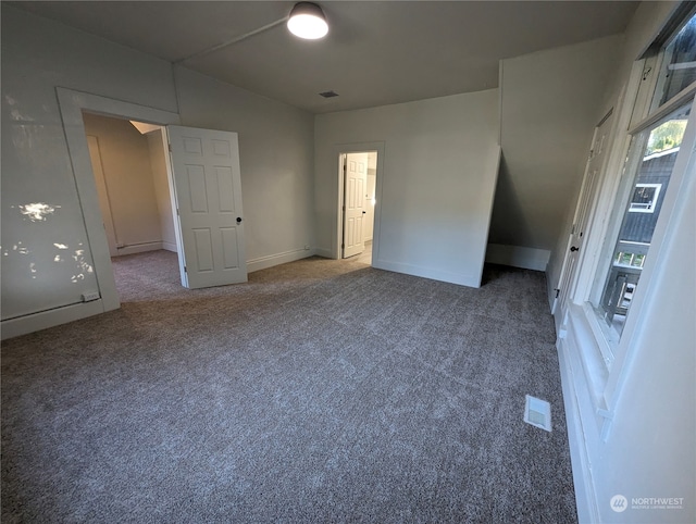 empty room featuring carpet flooring