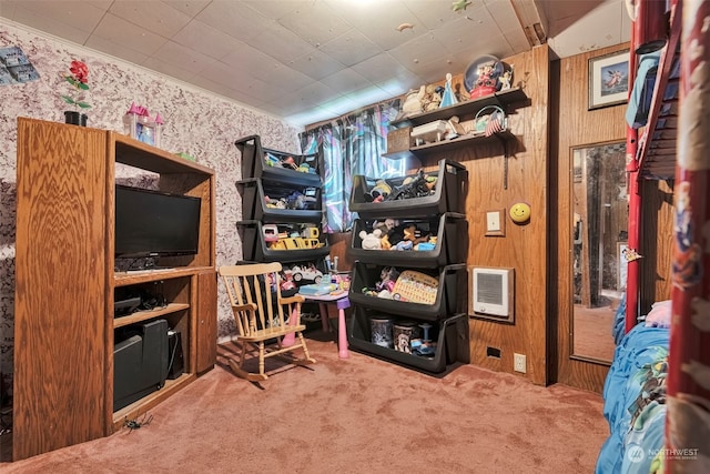 spacious closet with heating unit and carpet