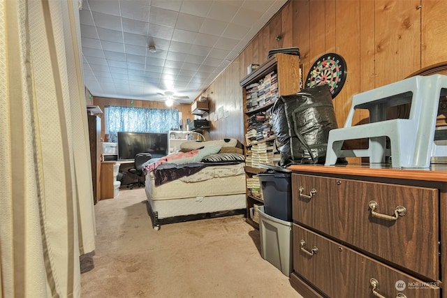 bedroom featuring wooden walls