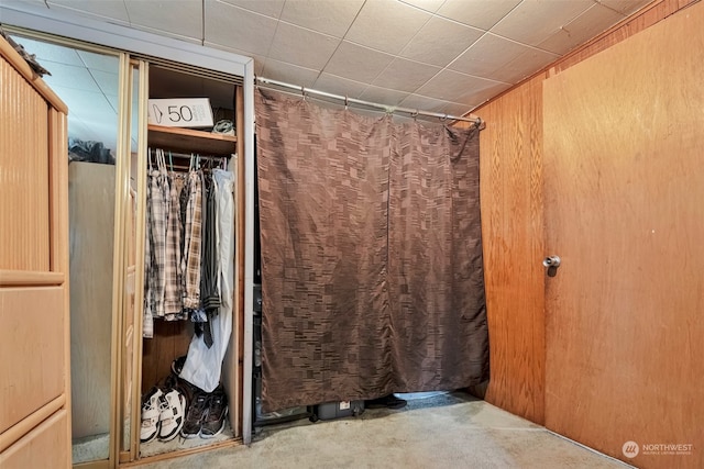 interior space featuring wood walls