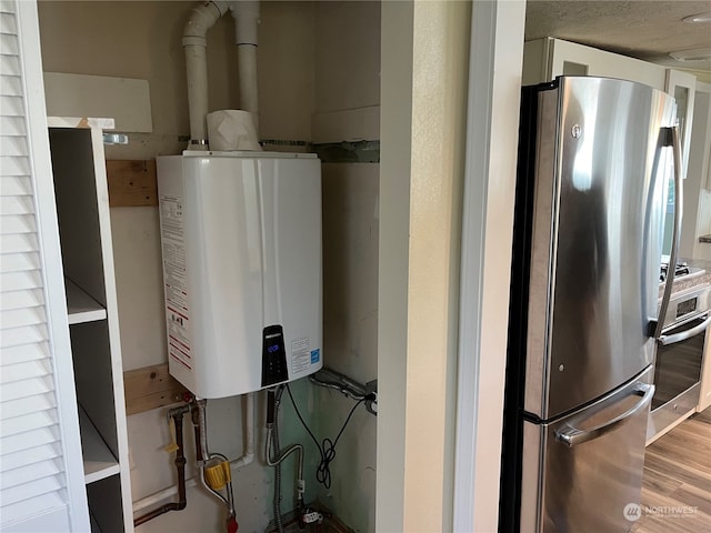 utility room featuring water heater