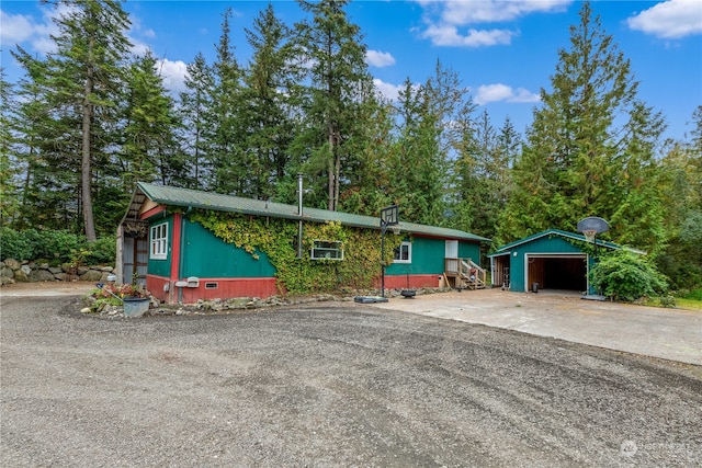 view of front of house featuring an outbuilding and a garage