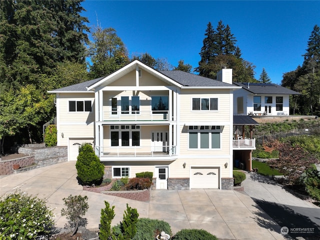 view of front facade with a balcony and a garage