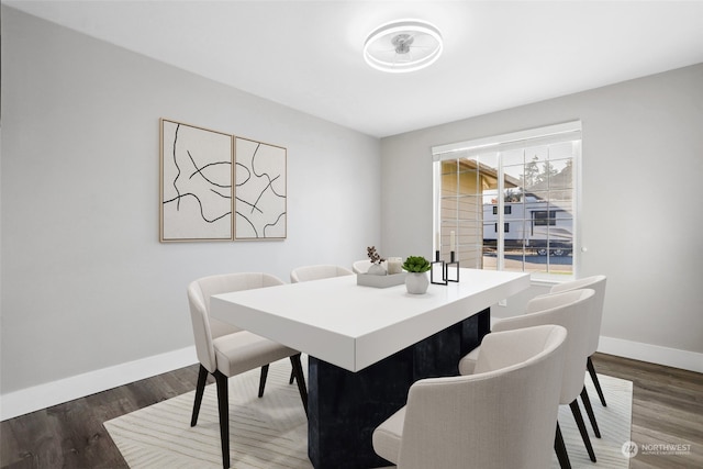 dining area with dark hardwood / wood-style floors