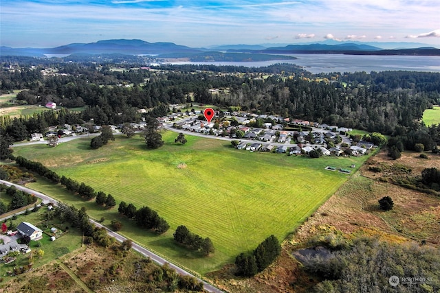 birds eye view of property with a rural view and a water and mountain view