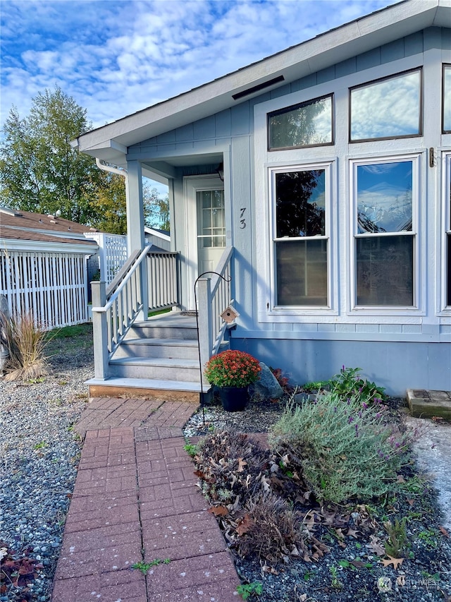 property entrance featuring a porch