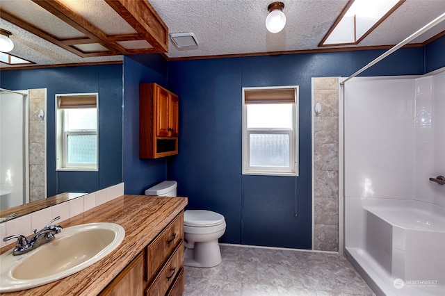 bathroom with toilet, a healthy amount of sunlight, and walk in shower