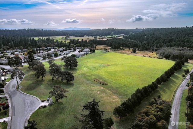 birds eye view of property with a rural view