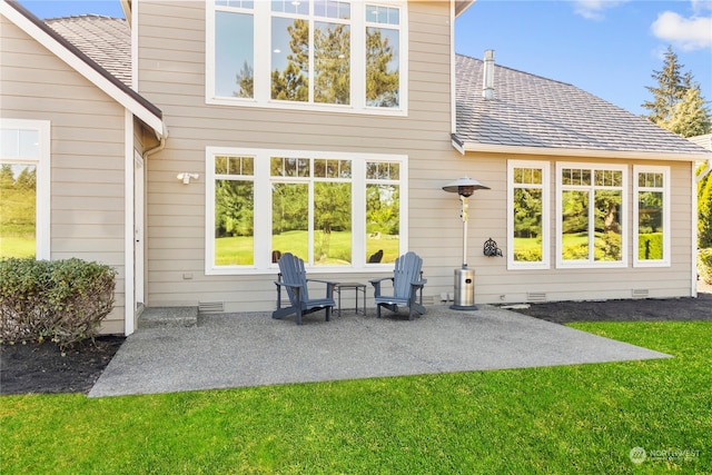 back of house featuring a yard and a patio area