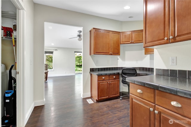 kitchen featuring ceiling fan and dark hardwood / wood-style flooring