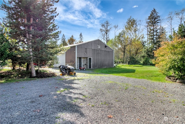 exterior space featuring a yard and a garage