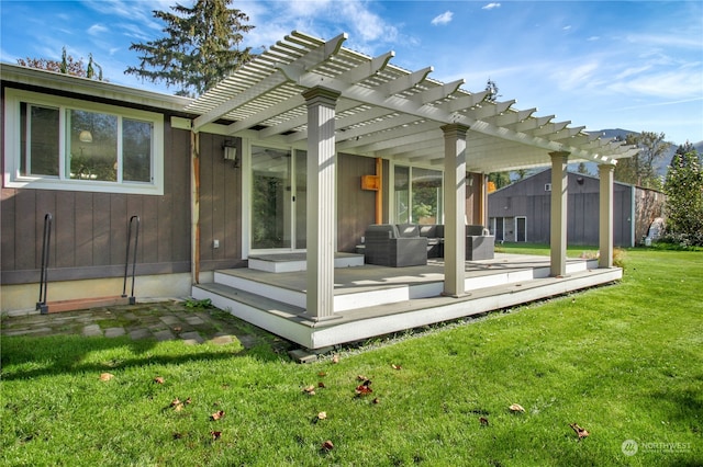 back of property featuring a pergola, an outdoor living space, a yard, and a deck