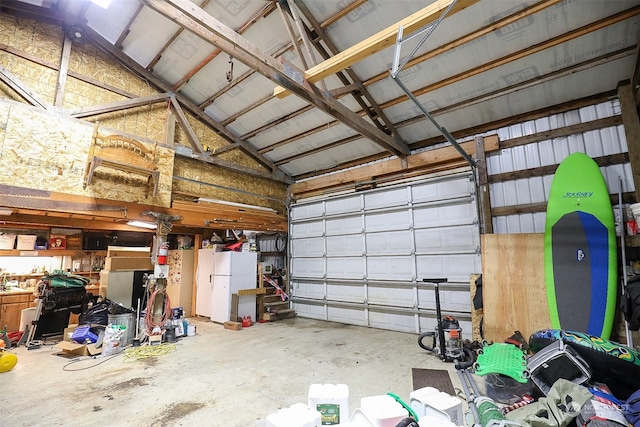 garage featuring white refrigerator