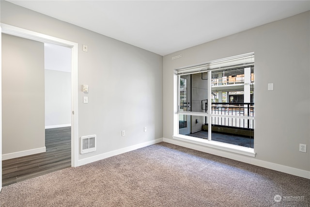 spare room featuring hardwood / wood-style floors