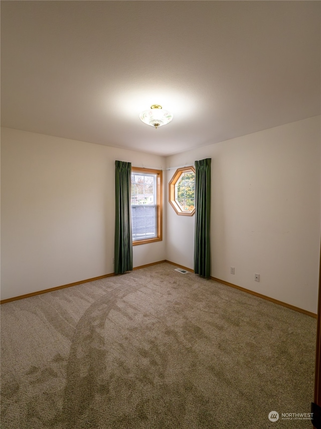 view of carpeted spare room