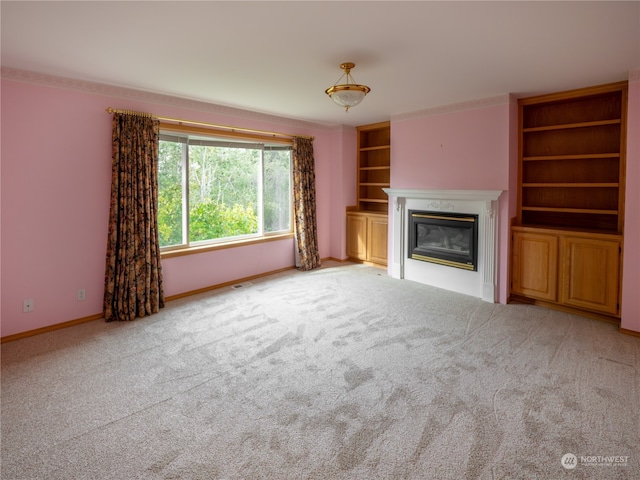 unfurnished living room featuring light colored carpet