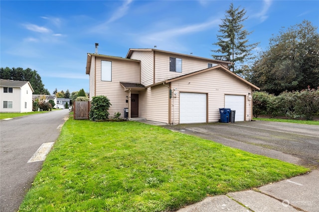 front facade with a front yard and a garage