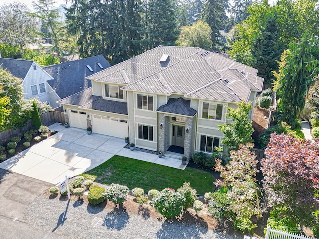 view of front of property with a front lawn and a garage