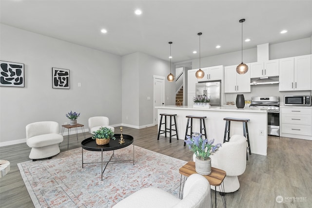 living room with light hardwood / wood-style floors