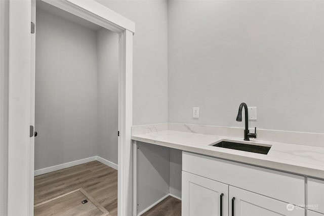 bathroom with hardwood / wood-style flooring and vanity