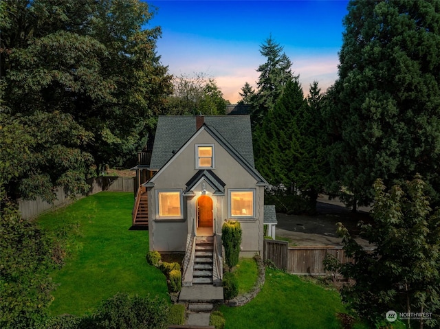 view of front of house with a lawn