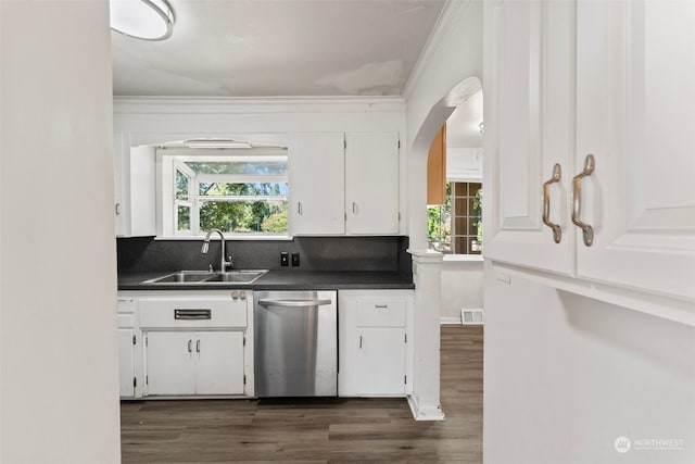 kitchen with stainless steel dishwasher, white cabinetry, sink, and plenty of natural light