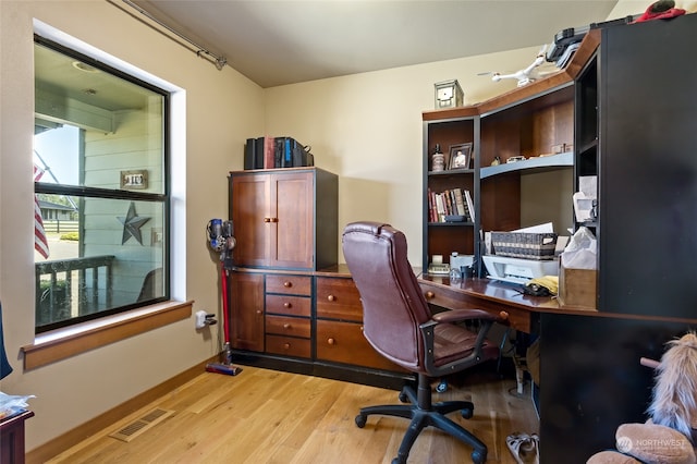 office with light wood-type flooring