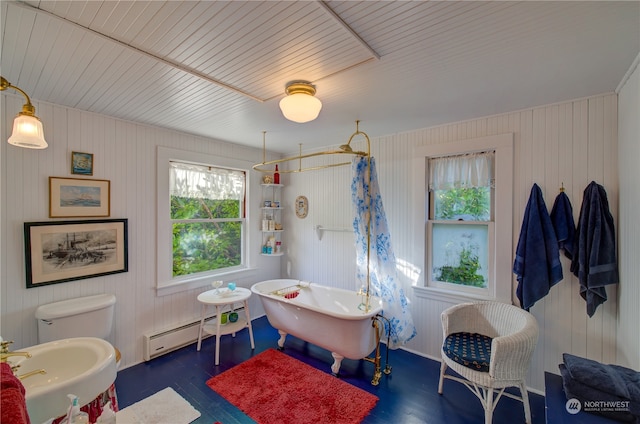 bathroom with wood-type flooring, a baseboard radiator, toilet, and separate shower and tub