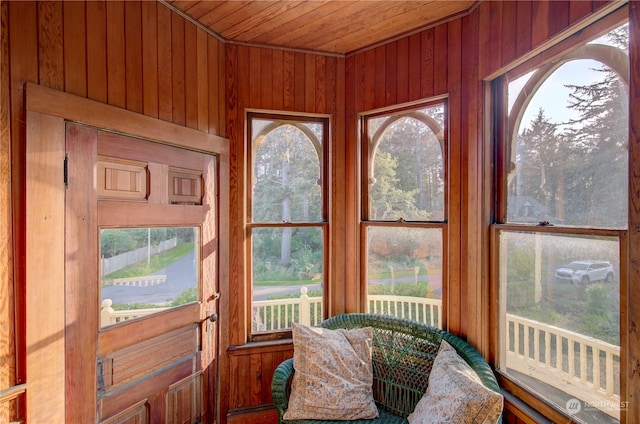 sunroom featuring wood ceiling