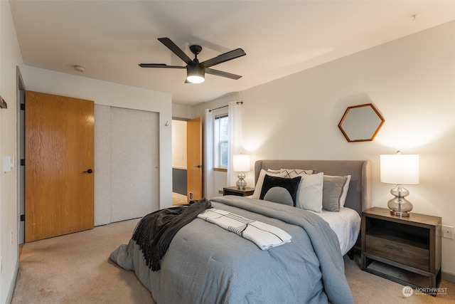 bedroom featuring ceiling fan and light carpet