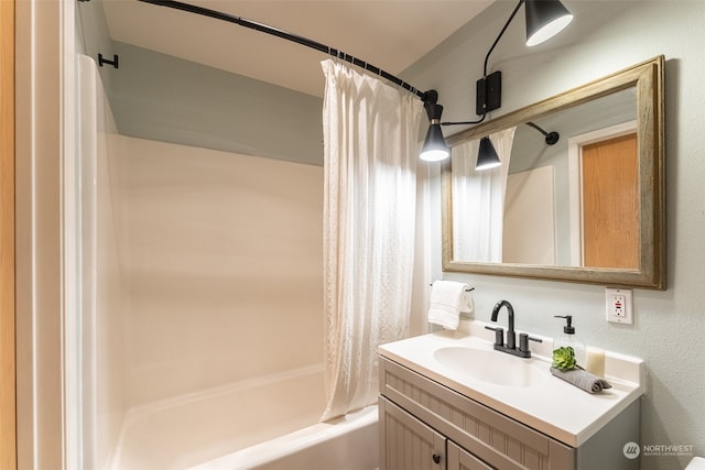 bathroom featuring vanity and shower / bath combo with shower curtain