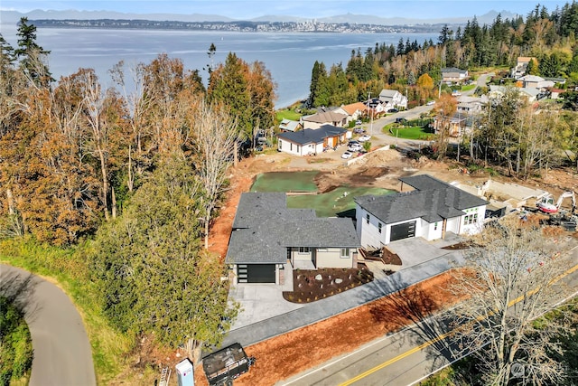 aerial view featuring a water and mountain view