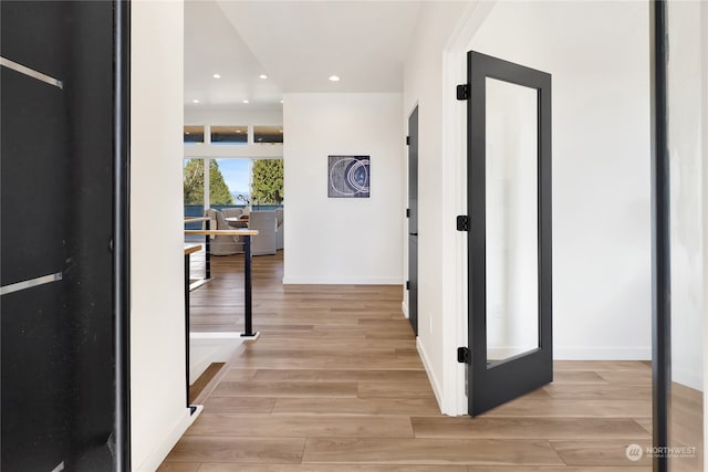 corridor featuring light hardwood / wood-style flooring