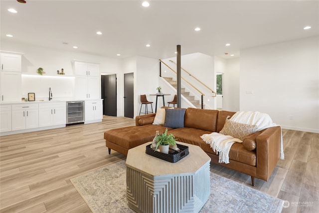 living room featuring light hardwood / wood-style flooring and wine cooler