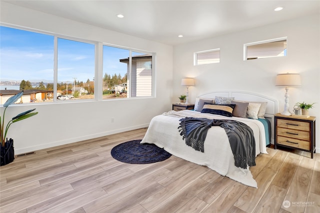 bedroom with light hardwood / wood-style floors