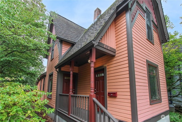 view of side of home with a balcony