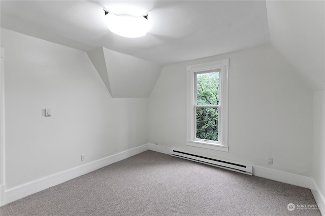 additional living space featuring carpet floors, a baseboard radiator, and lofted ceiling