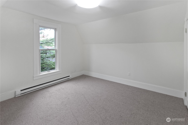 bonus room featuring lofted ceiling, carpet floors, and a baseboard radiator