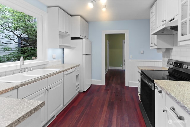 kitchen featuring white appliances and white cabinetry