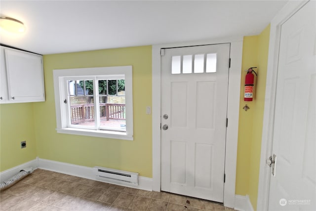 entryway featuring a baseboard radiator and light tile patterned flooring