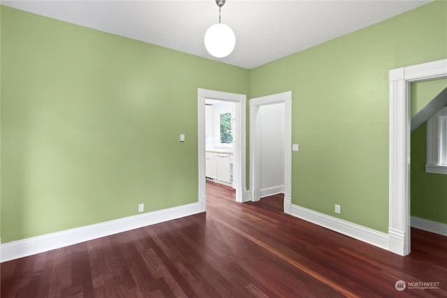 unfurnished bedroom featuring dark hardwood / wood-style flooring