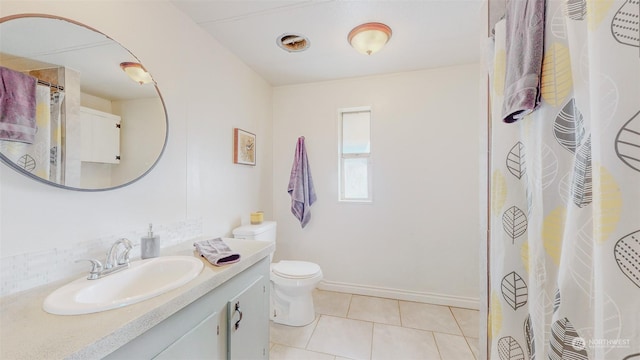 bathroom featuring toilet, baseboards, tile patterned flooring, a shower with shower curtain, and vanity